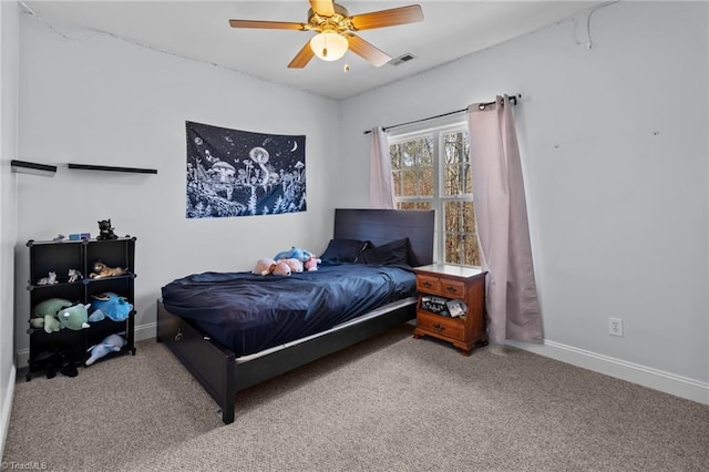 carpeted bedroom featuring visible vents, ceiling fan, and baseboards