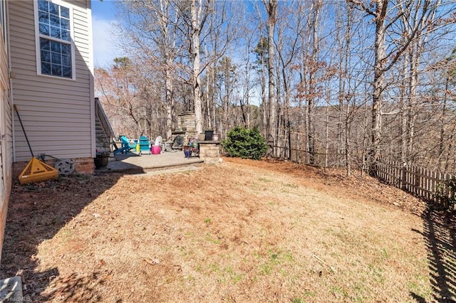 view of yard with a patio and fence