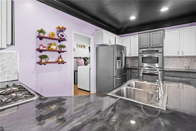 kitchen featuring stainless steel appliances, crown molding, white cabinetry, open shelves, and a sink