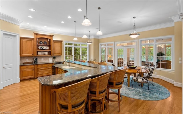 344 Lake Point Ln, Belews Creek, NC 27009 - kitchen featuring brown cabinets, open shelves, light wood-style flooring, crown molding, and recessed lighting