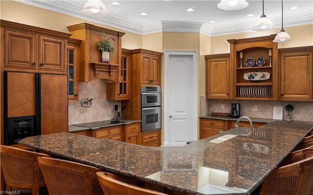 344 Lake Point Ln, Belews Creek, NC 27009 - kitchen featuring open shelves, brown cabinets, stainless steel double oven, a breakfast bar, and a sink