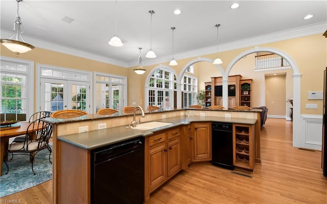 344 Lake Point Ln, Belews Creek, NC 27009 - kitchen featuring black dishwasher, french doors, a sink, light wood-style flooring, and crown molding