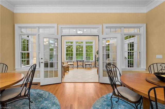 344 Lake Point Ln, Belews Creek, NC 27009 - dining room with french doors, ornamental molding, wood finished floors, and plenty of natural light