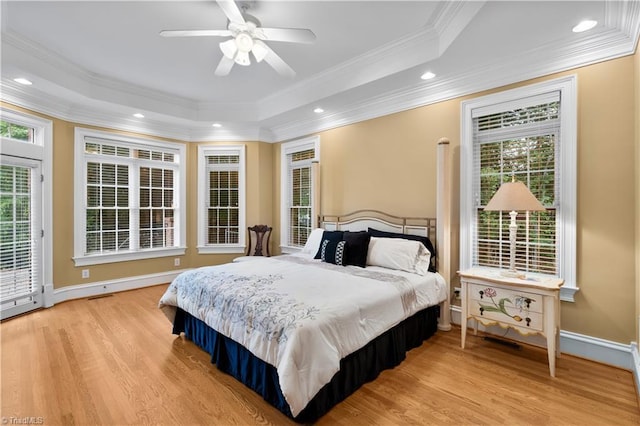344 Lake Point Ln, Belews Creek, NC 27009 - bedroom featuring wood finished floors, ornamental molding, a tray ceiling, access to exterior, and recessed lighting
