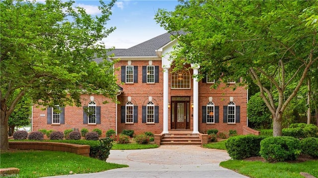 344 Lake Point Ln, Belews Creek, NC 27009 - view of front facade featuring brick siding and a front yard