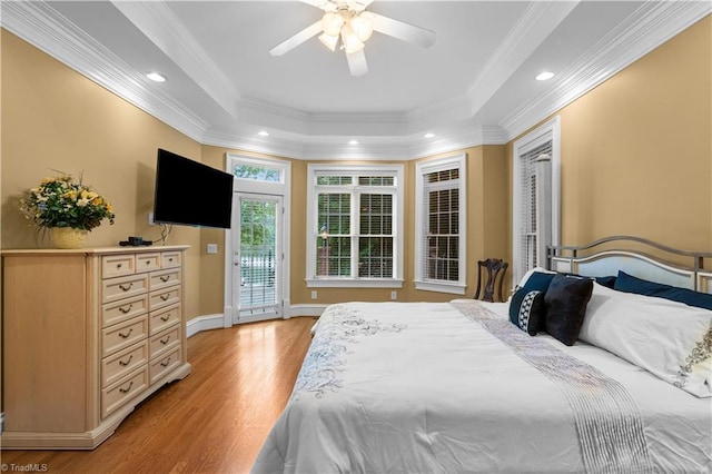 344 Lake Point Ln, Belews Creek, NC 27009 - bedroom with access to exterior, light wood-style floors, recessed lighting, crown molding, and a tray ceiling