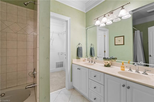 344 Lake Point Ln, Belews Creek, NC 27009 - full bath featuring crown molding, double vanity, tile patterned flooring, shower / bath combo with shower curtain, and a walk in closet