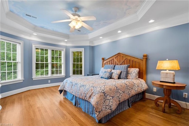 344 Lake Point Ln, Belews Creek, NC 27009 - bedroom with a tray ceiling, wood finished floors, ornamental molding, baseboards, and recessed lighting
