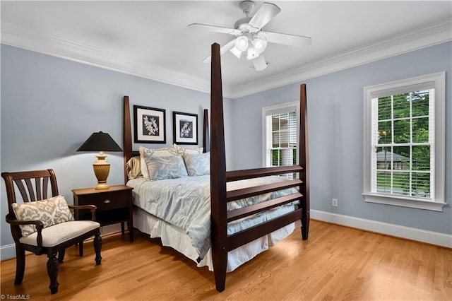 344 Lake Point Ln, Belews Creek, NC 27009 - bedroom featuring crown molding, light wood-type flooring, baseboards, and a ceiling fan