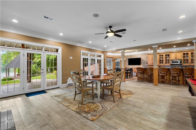 344 Lake Point Ln, Belews Creek, NC 27009 - dining room featuring french doors, crown molding, recessed lighting, a ceiling fan, and decorative columns
