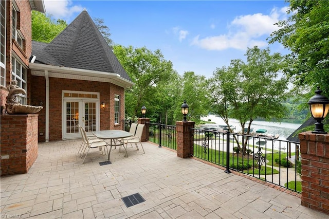344 Lake Point Ln, Belews Creek, NC 27009 - view of patio with french doors, a water view, and outdoor dining area