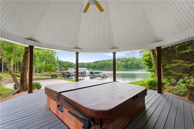 344 Lake Point Ln, Belews Creek, NC 27009 - wooden terrace with a covered hot tub, a water view, and a ceiling fan