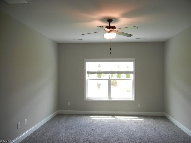 715 Cannonade Dr, Whitsett, NC 27377 - spare room featuring carpet and ceiling fan