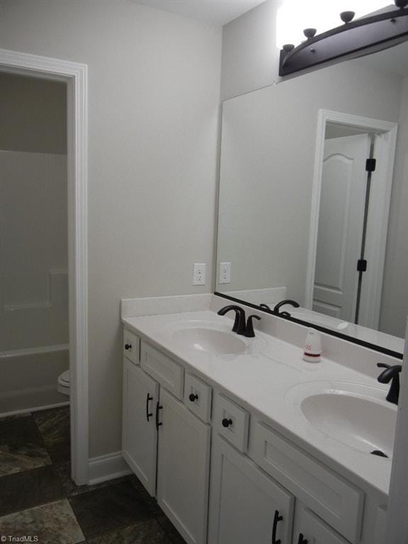 715 Cannonade Dr, Whitsett, NC 27377 - full bath with double vanity and toilet