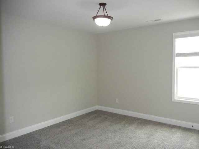715 Cannonade Dr, Whitsett, NC 27377 - unfurnished room featuring carpet and baseboards