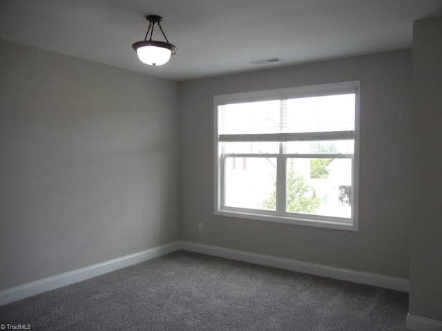 715 Cannonade Dr, Whitsett, NC 27377 - carpeted spare room featuring healthy amount of natural light