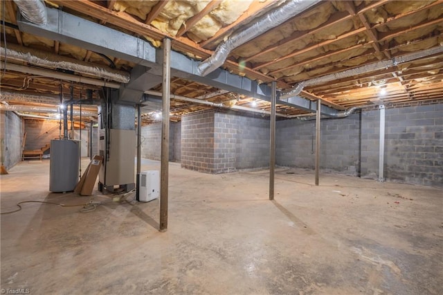 unfinished basement featuring water heater and heating unit