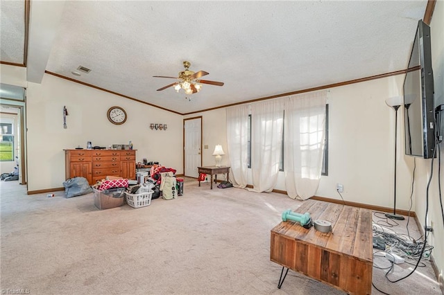 carpeted living room with ceiling fan, crown molding, and a textured ceiling