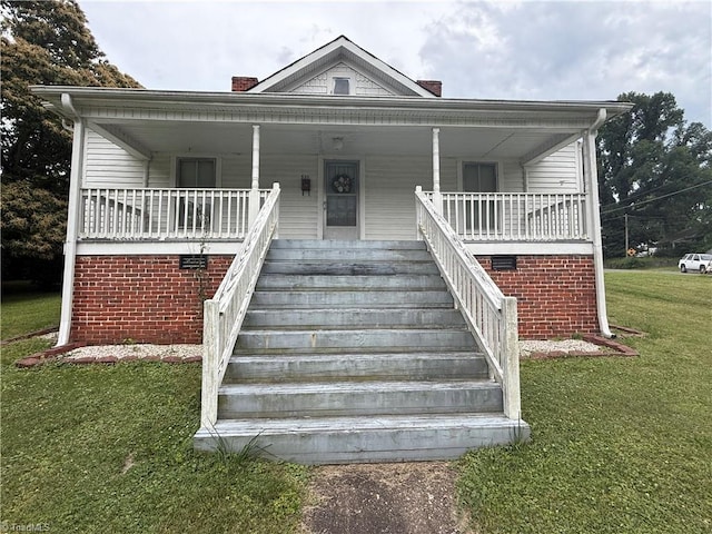 535 Worth St, Mount Airy, NC 27030 - bungalow-style house with a front yard, covered porch, and stairs
