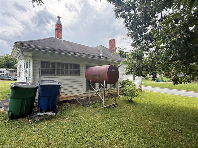 535 Worth St, Mount Airy, NC 27030 - back of property with a lawn and a chimney