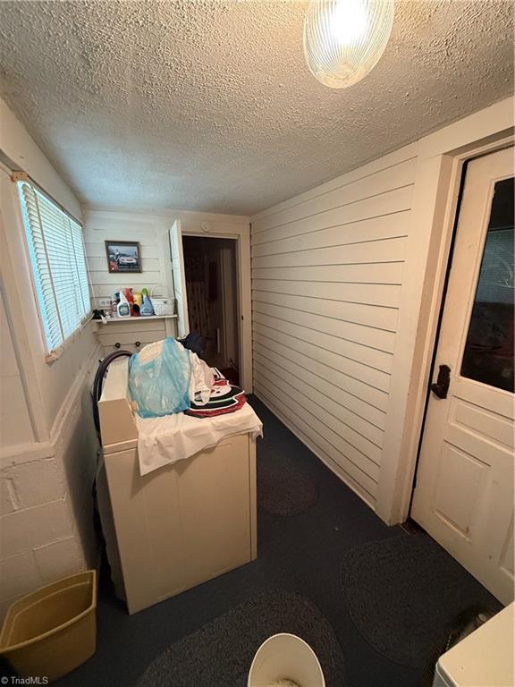 535 Worth St, Mount Airy, NC 27030 - living area with a textured ceiling and wood walls