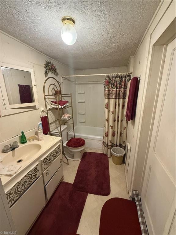 535 Worth St, Mount Airy, NC 27030 - bathroom with vanity, a textured ceiling, toilet, and shower / tub combo with curtain