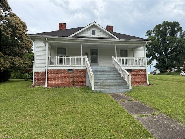 535 Worth St, Mount Airy, NC 27030 - bungalow-style home featuring a chimney, a front lawn, and stairs