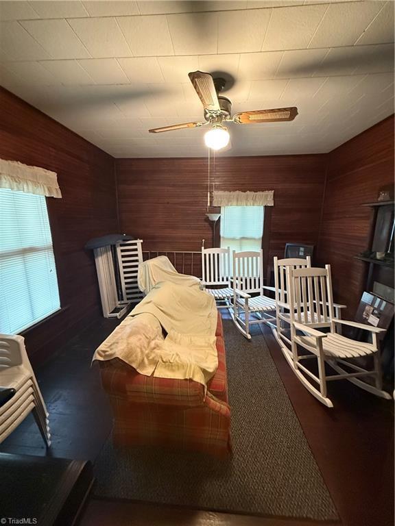 535 Worth St, Mount Airy, NC 27030 - bedroom featuring wood walls and a ceiling fan