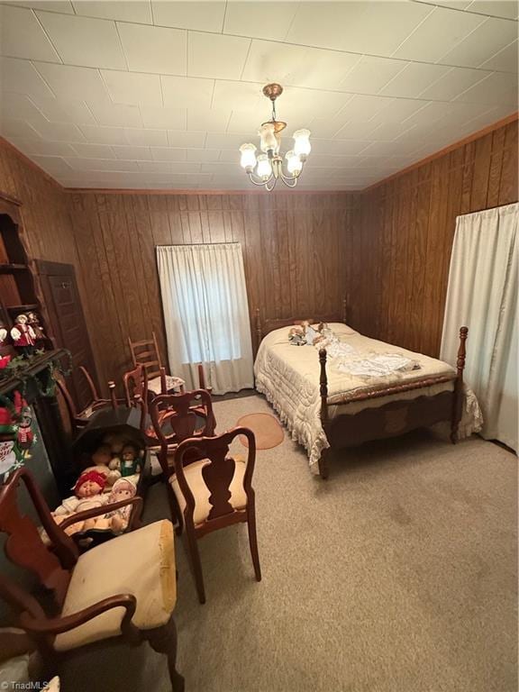 535 Worth St, Mount Airy, NC 27030 - bedroom with light colored carpet, wood walls, and a chandelier