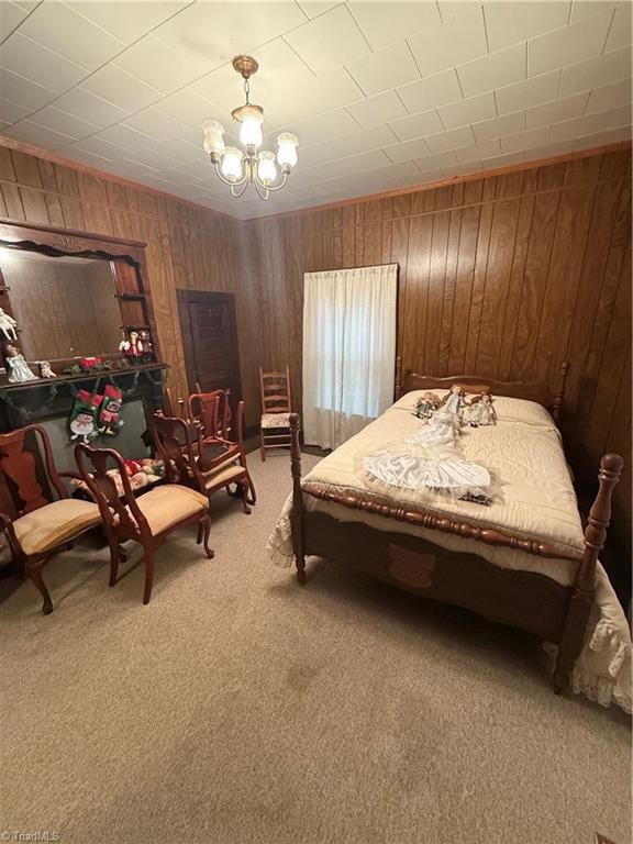 535 Worth St, Mount Airy, NC 27030 - bedroom with light colored carpet, wooden walls, and a chandelier