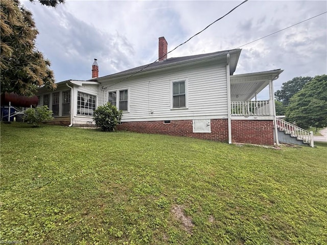 535 Worth St, Mount Airy, NC 27030 - back of house featuring a chimney, a yard, crawl space, and stairs