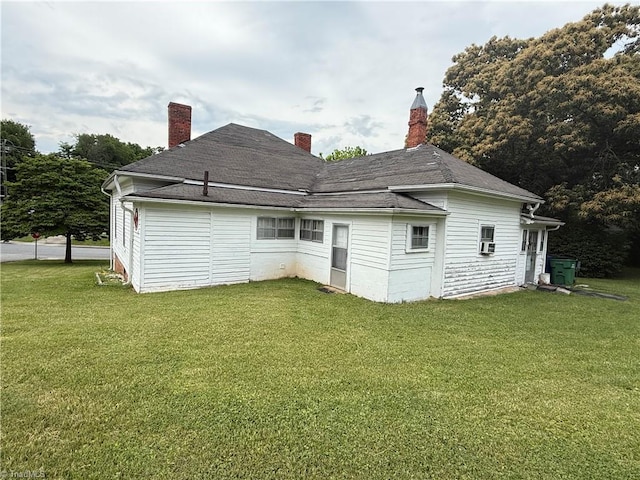 535 Worth St, Mount Airy, NC 27030 - back of house with a yard, a chimney, and a shingled roof