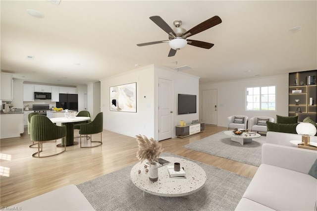 living room featuring ceiling fan, light hardwood / wood-style floors, and ornamental molding