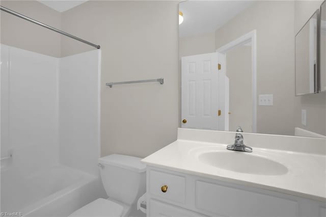 full bathroom with toilet, vanity, and  shower combination