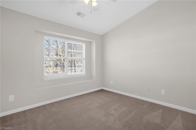 unfurnished room featuring ceiling fan, carpet, and vaulted ceiling