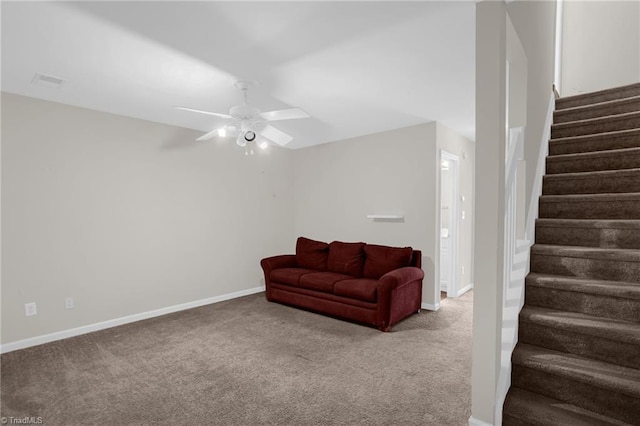 living room featuring ceiling fan and carpet floors