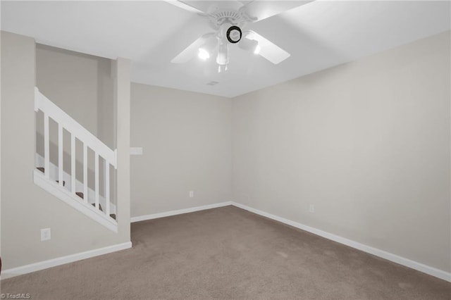 unfurnished room with ceiling fan and carpet floors