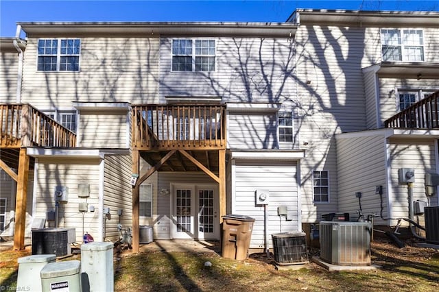 back of property featuring central AC unit