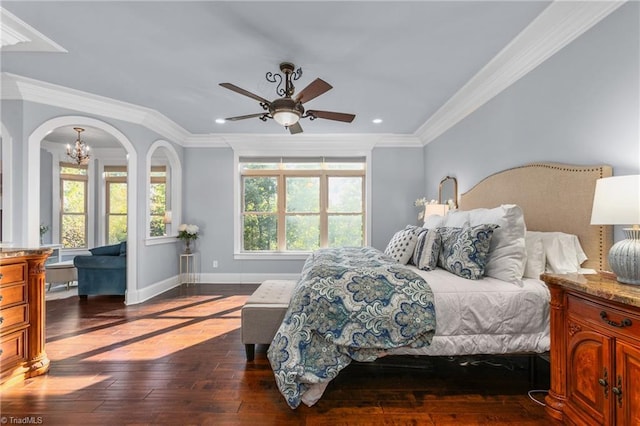 bedroom featuring ceiling fan with notable chandelier, ornamental molding, and multiple windows