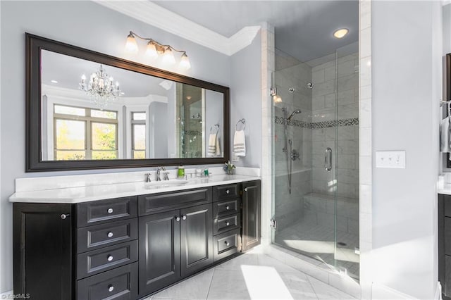 bathroom featuring vanity, an inviting chandelier, tile patterned floors, ornamental molding, and an enclosed shower