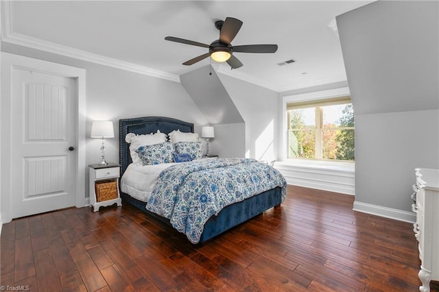 bedroom featuring ornamental molding, ceiling fan, and dark wood-type flooring