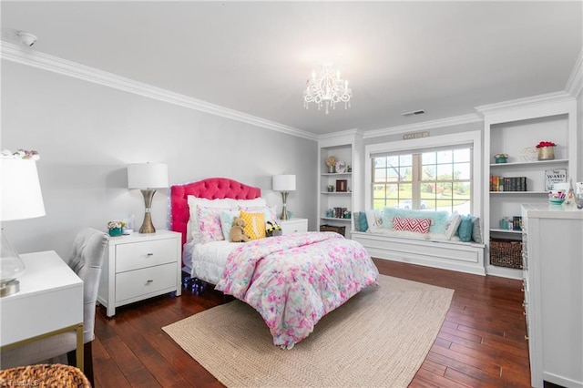 bedroom featuring ornamental molding, dark wood-type flooring, and an inviting chandelier