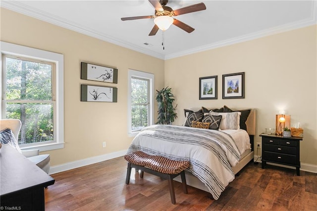 bedroom featuring ceiling fan, crown molding, and dark wood-type flooring