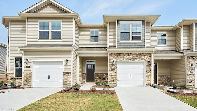 1372 Amberview Ln, Kernersville, NC 27284 - townhome / multi-family property featuring concrete driveway, stone siding, and an attached garage