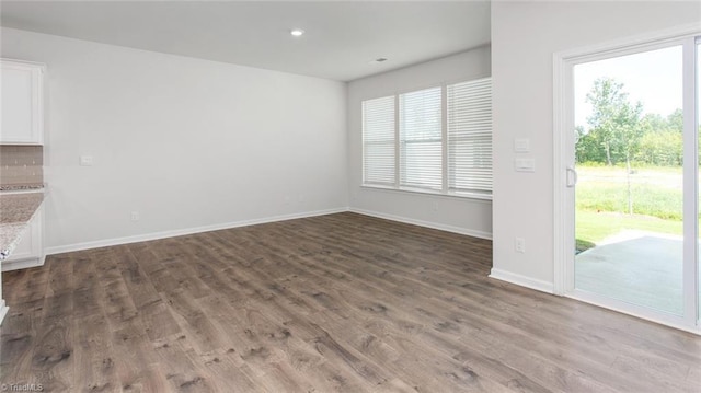1372 Amberview Ln, Kernersville, NC 27284 - unfurnished living room with baseboards, recessed lighting, and wood finished floors