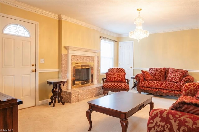 carpeted living room with an inviting chandelier, a high end fireplace, and ornamental molding