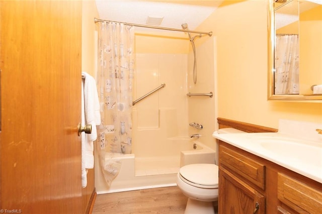 bathroom with wood-type flooring, toilet, and vanity