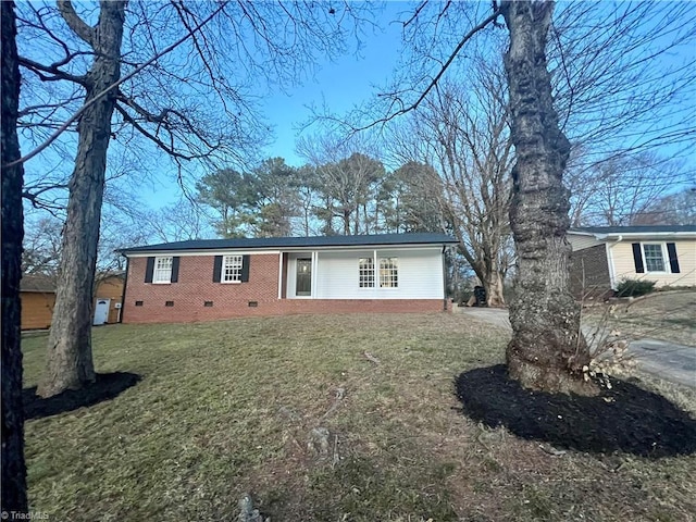 ranch-style home with a front lawn