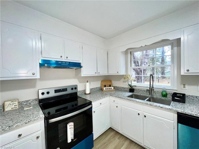 kitchen featuring white cabinets, stainless steel appliances, light hardwood / wood-style flooring, and sink