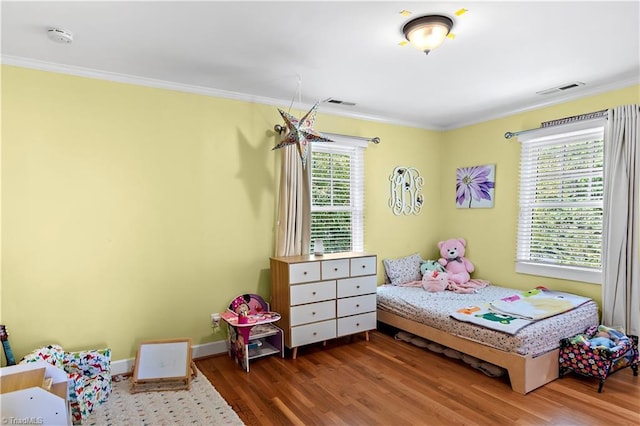 10 W Banner Ave, Winston-Salem, NC 27127 - bedroom featuring wood finished floors, crown molding, and baseboards